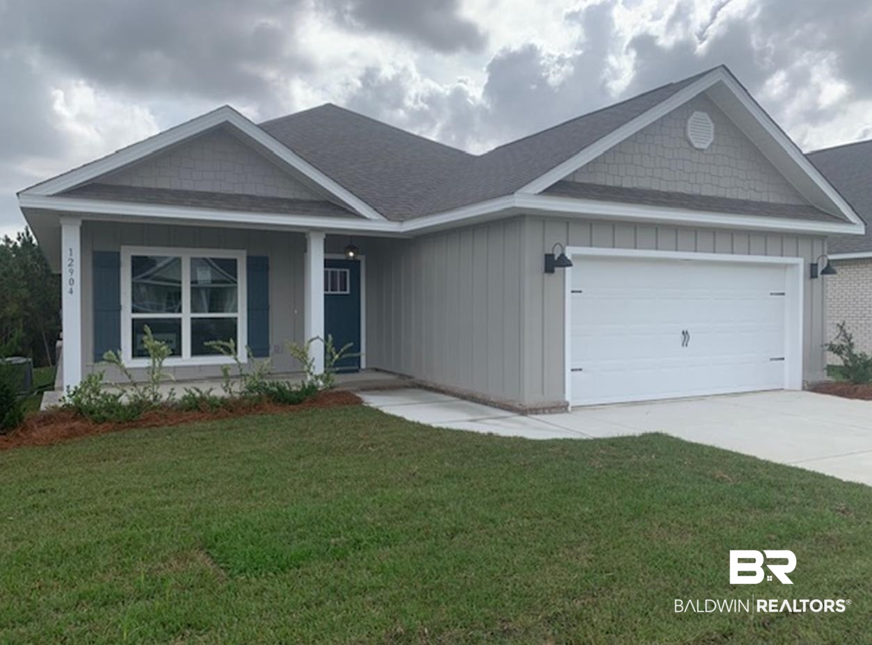 12904 Grand Rpds Road Fairhope, AL 36532 - Photo 1 of 34 View of front of property featuring a garage and a front lawn