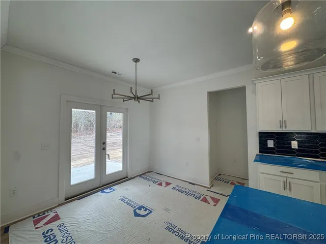 a view of workspace with furniture and window