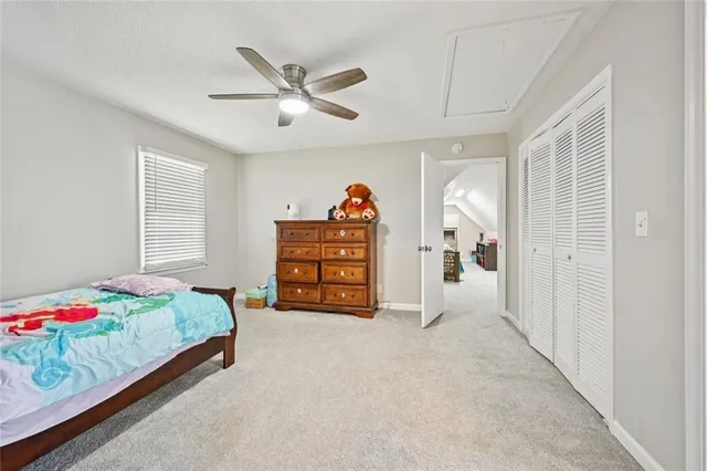 a bedroom with bed and a window