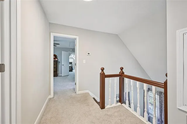 a en suite bathroom with 2 sink tub and a mirror