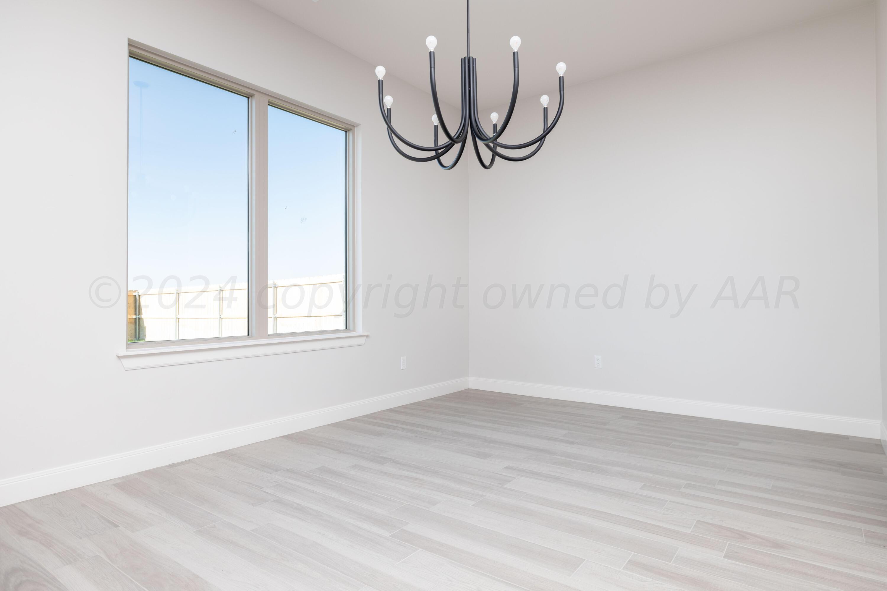 10201 Cactus Flower Road Amarillo, TX 79119 - Photo 14 of 48 a view of a room with wooden floor and fan