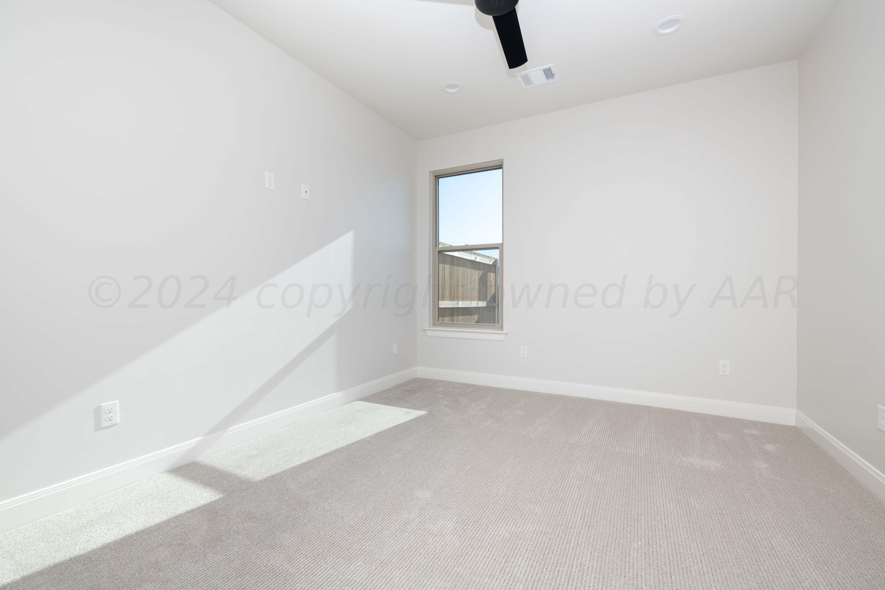 10201 Cactus Flower Road Amarillo, TX 79119 - Photo 24 of 48 a view of an empty room with a window