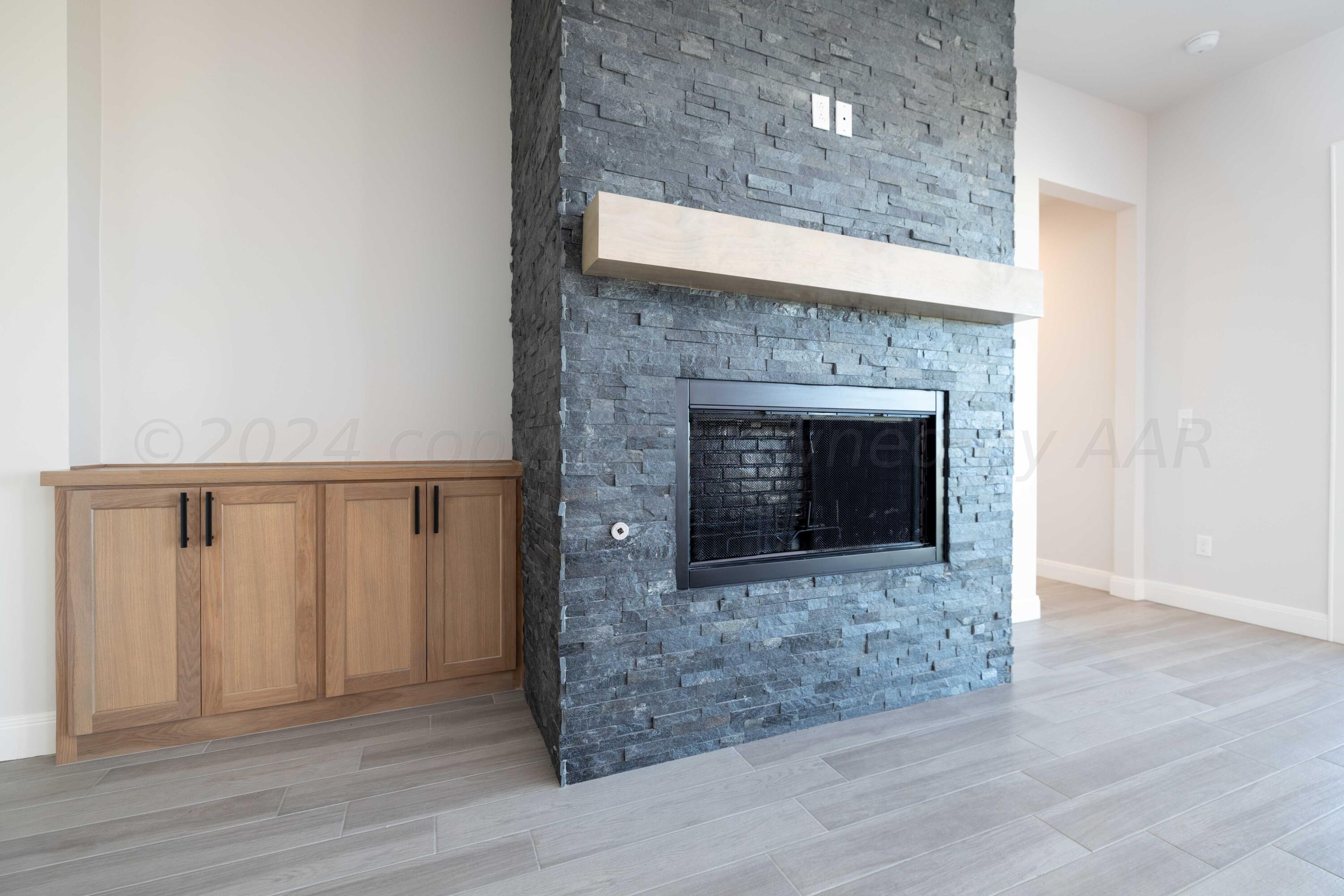 10201 Cactus Flower Road Amarillo, TX 79119 - Photo 3 of 48 a living room with a fireplace