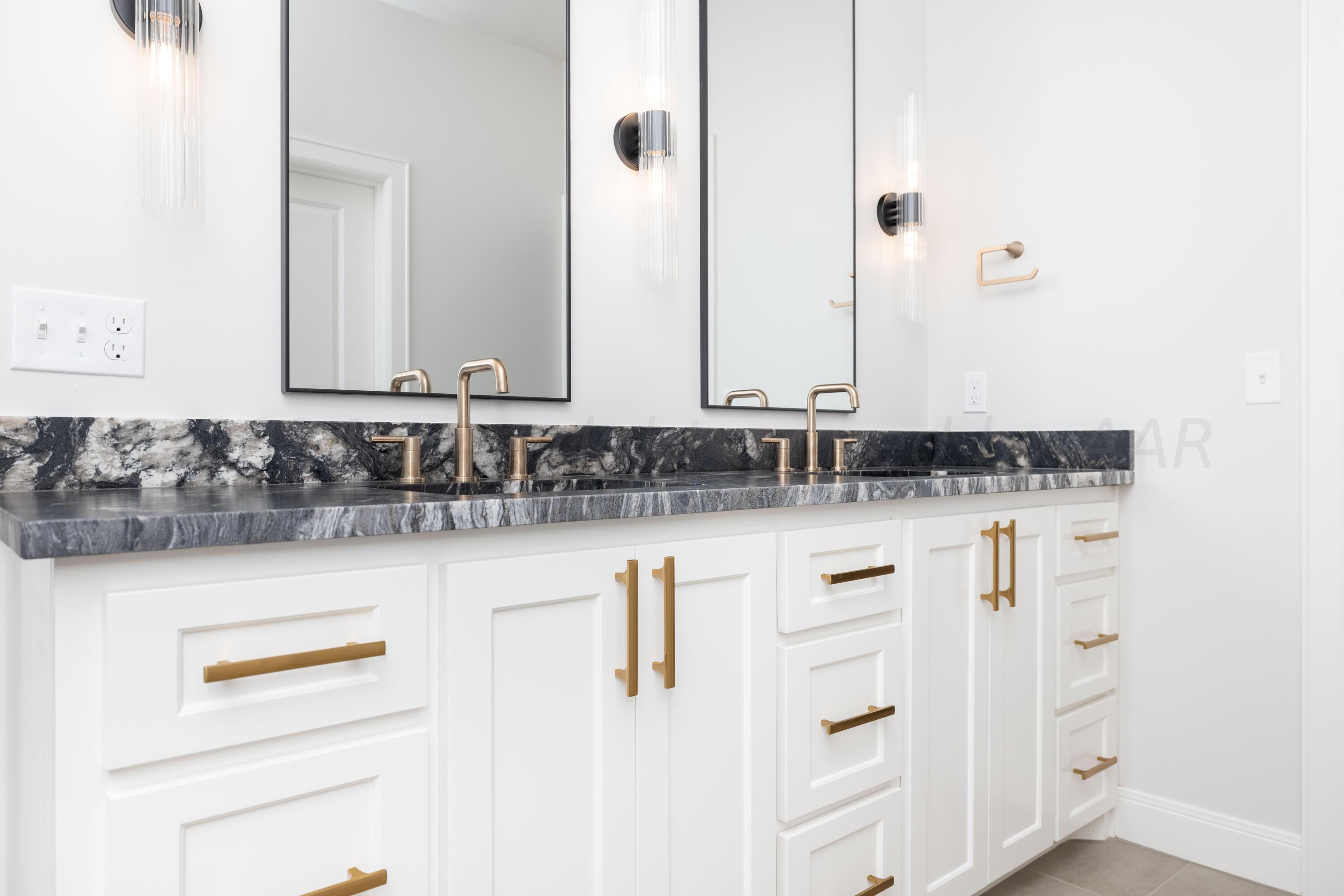 10201 Cactus Flower Road Amarillo, TX 79119 - Photo 36 of 48 a bathroom with a sink and a mirror