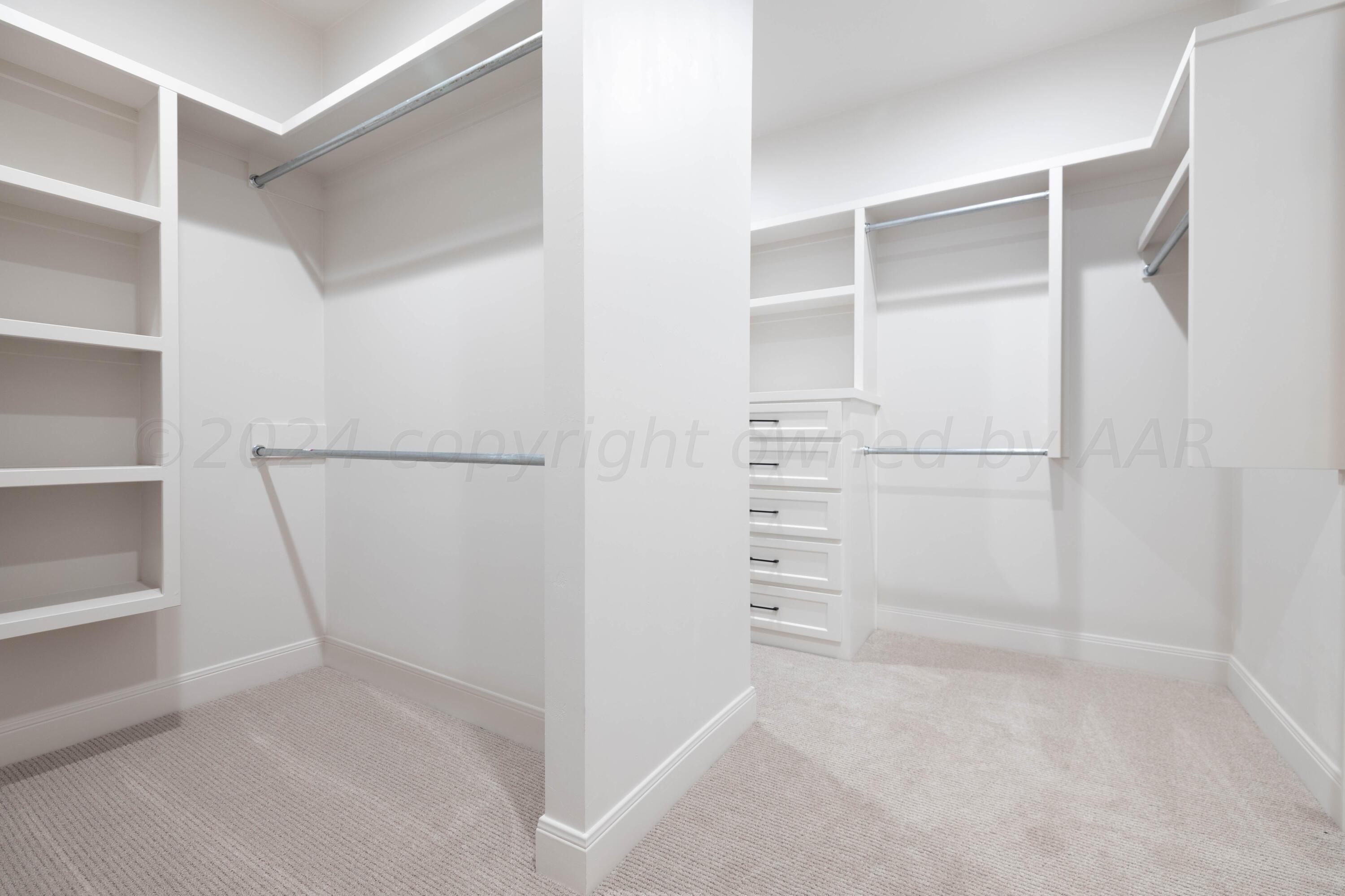 10201 Cactus Flower Road Amarillo, TX 79119 - Photo 38 of 48 a view of walk in closet with empty racks