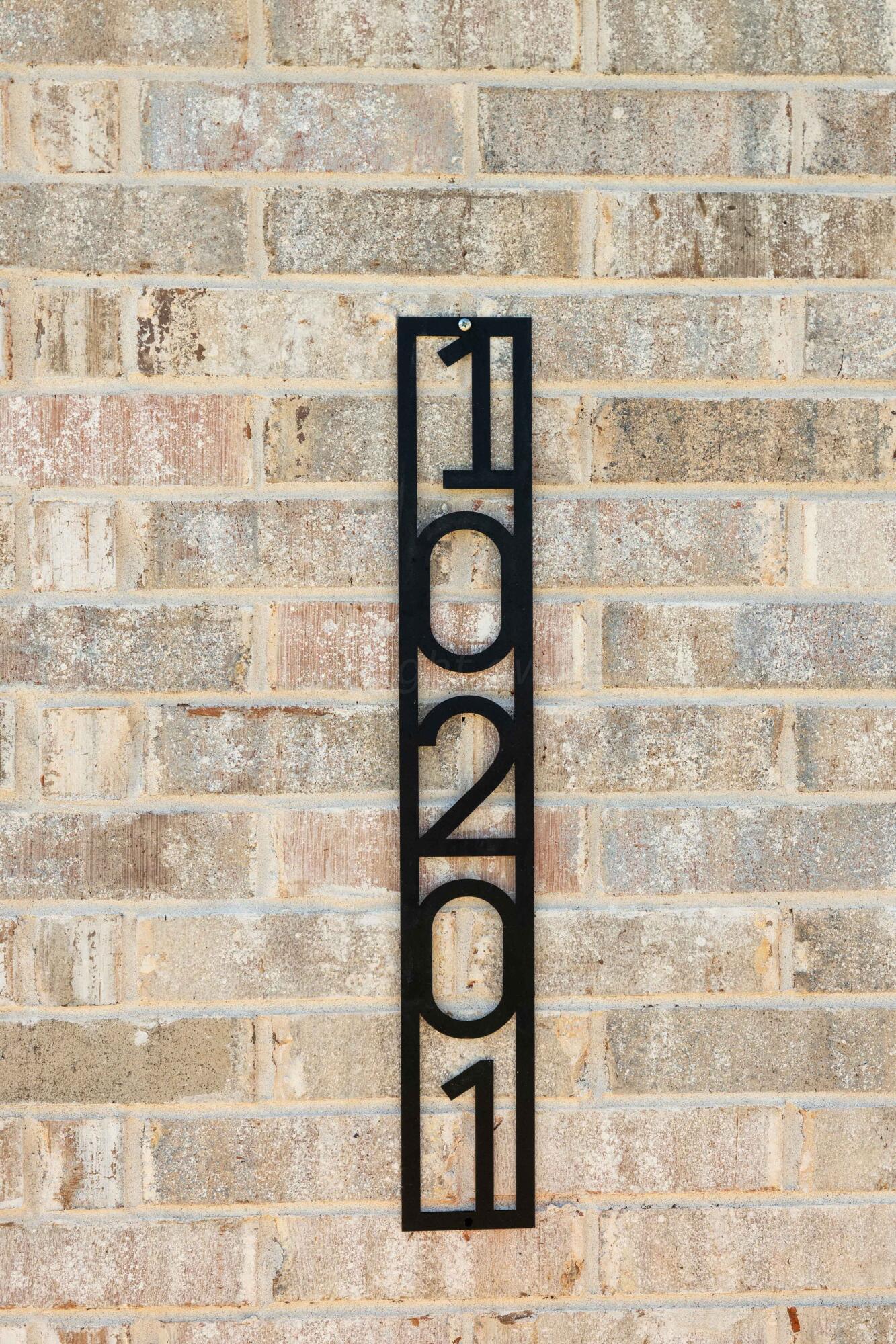 10201 Cactus Flower Road Amarillo, TX 79119 - Photo 41 of 48 a brick wall with a potted plant on it