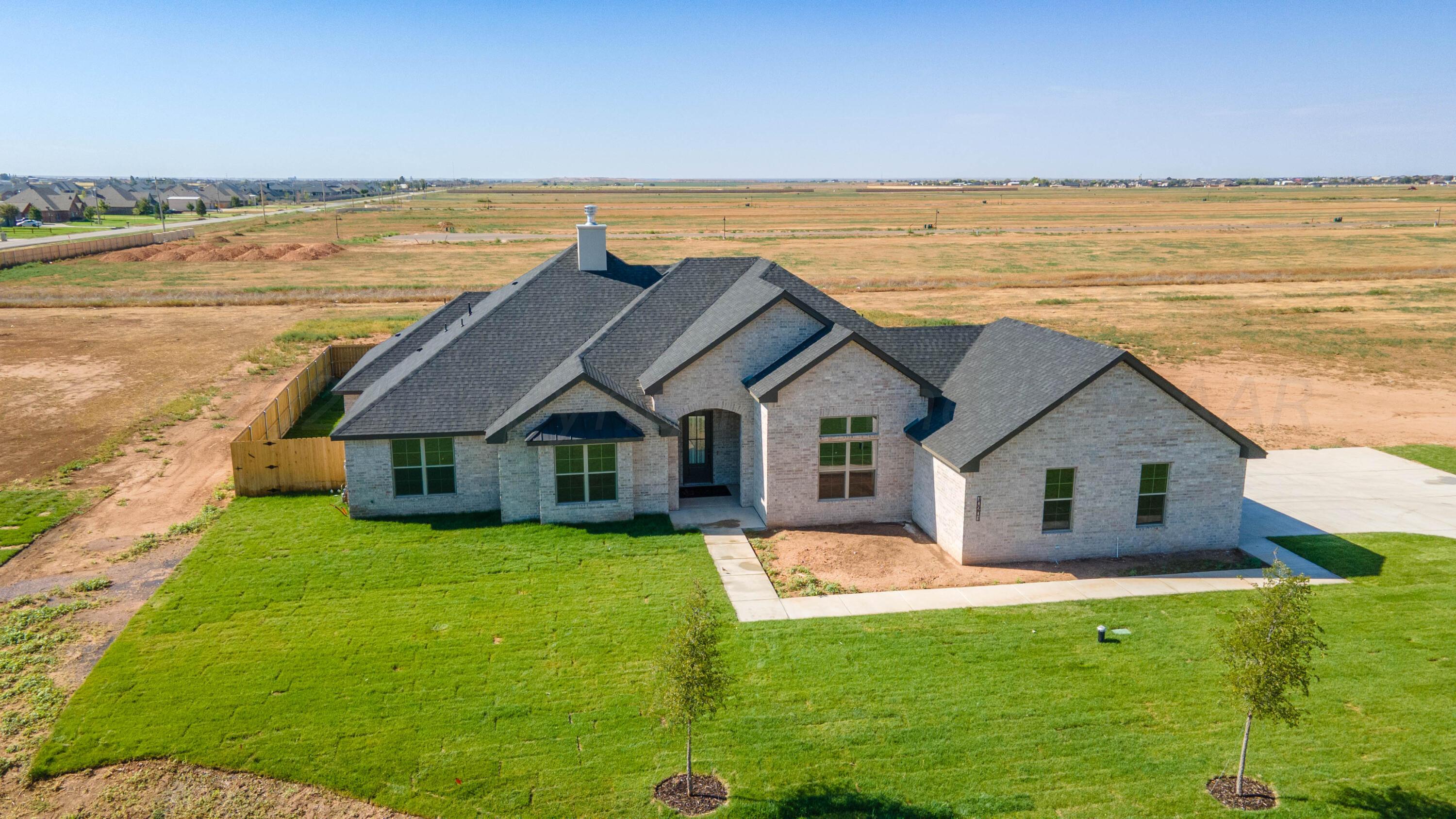 10201 Cactus Flower Road Amarillo, TX 79119 - Photo 44 of 48 a front view of house with yard and ocean view