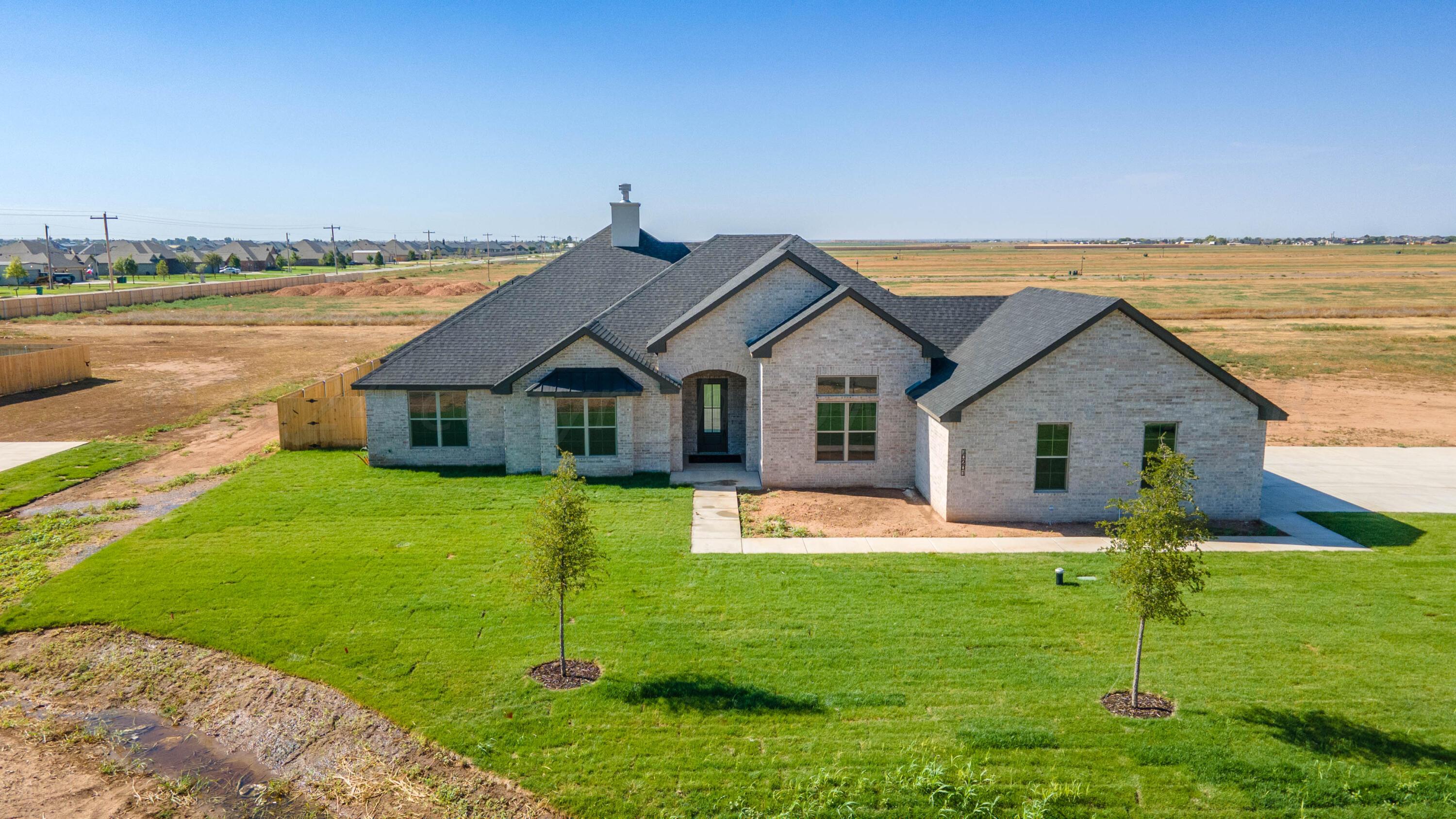 10201 Cactus Flower Road Amarillo, TX 79119 - Photo 46 of 48 a front view of house with yard and green space