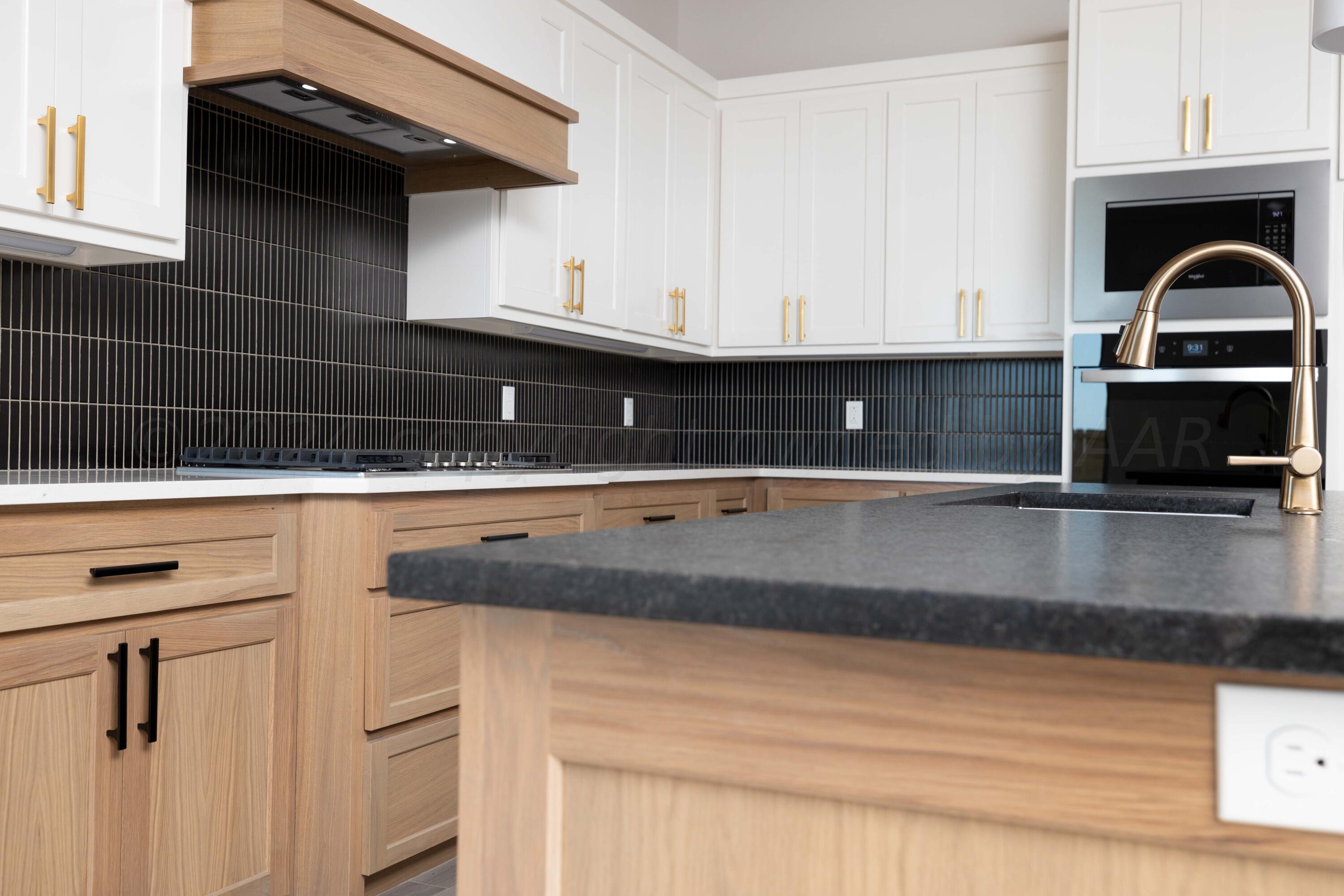 10201 Cactus Flower Road Amarillo, TX 79119 - Photo 9 of 48 a kitchen with a sink and cabinets