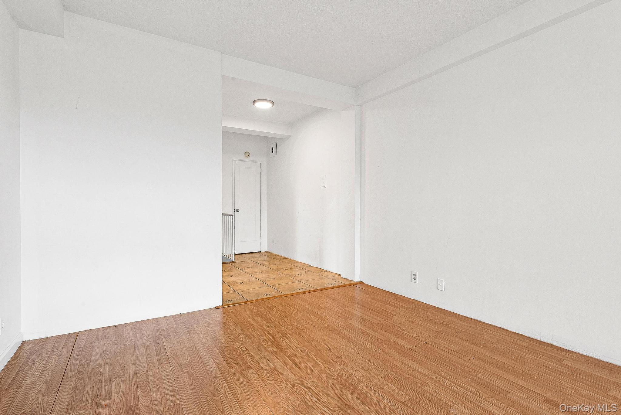 99-32 66th Road, Unit 5B Queens, NY 11374 - Photo 18 of 27 Empty room featuring light wood-style flooring