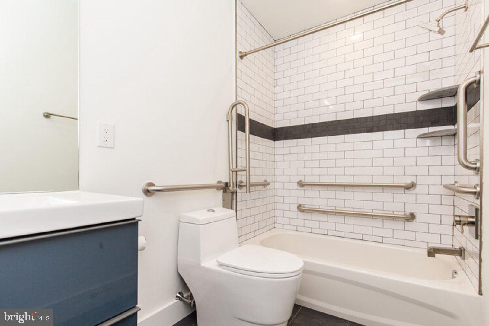 4100 Ludlow Street, Unit 1N Philadelphia, PA 19104 - Photo 13 of 16 a bathroom with a toilet and a bathtub
