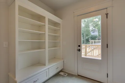 a view of an empty room with a window