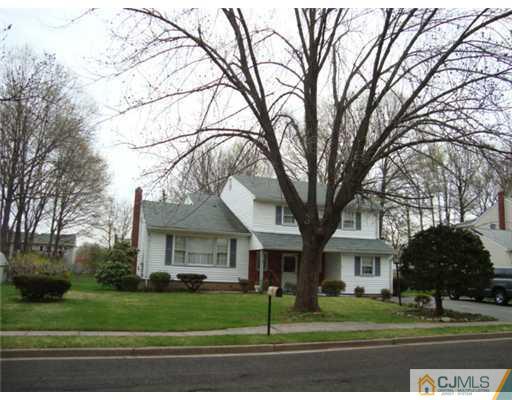 12 Hilltop Road Edison, NJ 08820 - Photo 1 of 23 a front view of a house with a garden