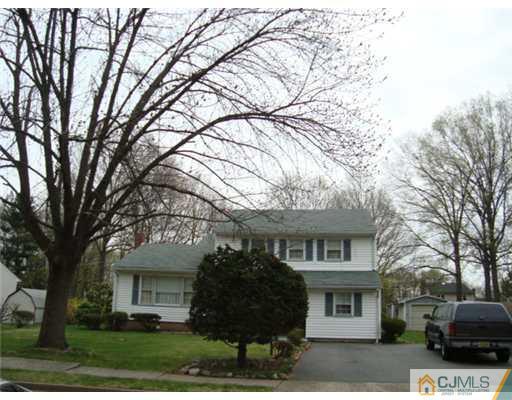 12 Hilltop Road Edison, NJ 08820 - Photo 2 of 23 a front view of a house with garden