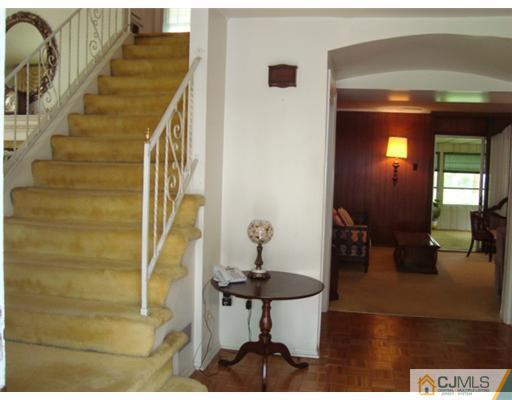 12 Hilltop Road Edison, NJ 08820 - Photo 16 of 23 a view of entryway and hall with wooden floor