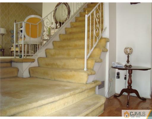 12 Hilltop Road Edison, NJ 08820 - Photo 17 of 23 a view of entryway and hall with wooden floor