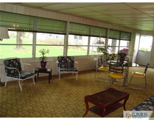 12 Hilltop Road Edison, NJ 08820 - Photo 20 of 23 a living room with furniture and a large window