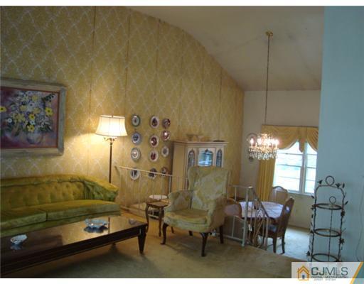 12 Hilltop Road Edison, NJ 08820 - Photo 4 of 23 a living room with furniture and a window