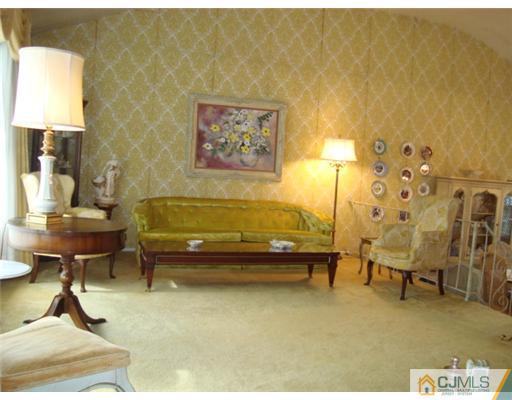 12 Hilltop Road Edison, NJ 08820 - Photo 5 of 23 a view of a swimming pool with chairs