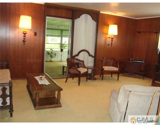 12 Hilltop Road Edison, NJ 08820 - Photo 9 of 23 a living room with furniture and a window