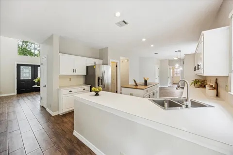 a living room with furniture or fireplace and a rug