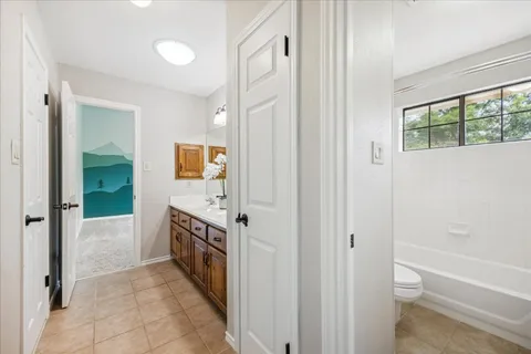 a bathroom with a bathtub and a sink