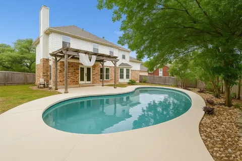 swimming pool view with a outdoor space