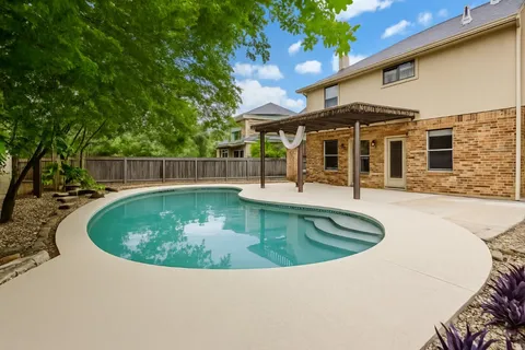 a view of a house with swimming pool