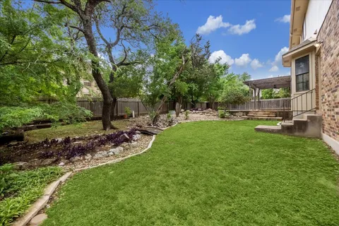 a view of a park with large trees