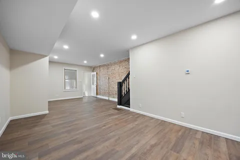 a kitchen with granite countertop stainless steel appliances and wooden cabinets