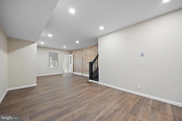 a kitchen with granite countertop stainless steel appliances and wooden cabinets