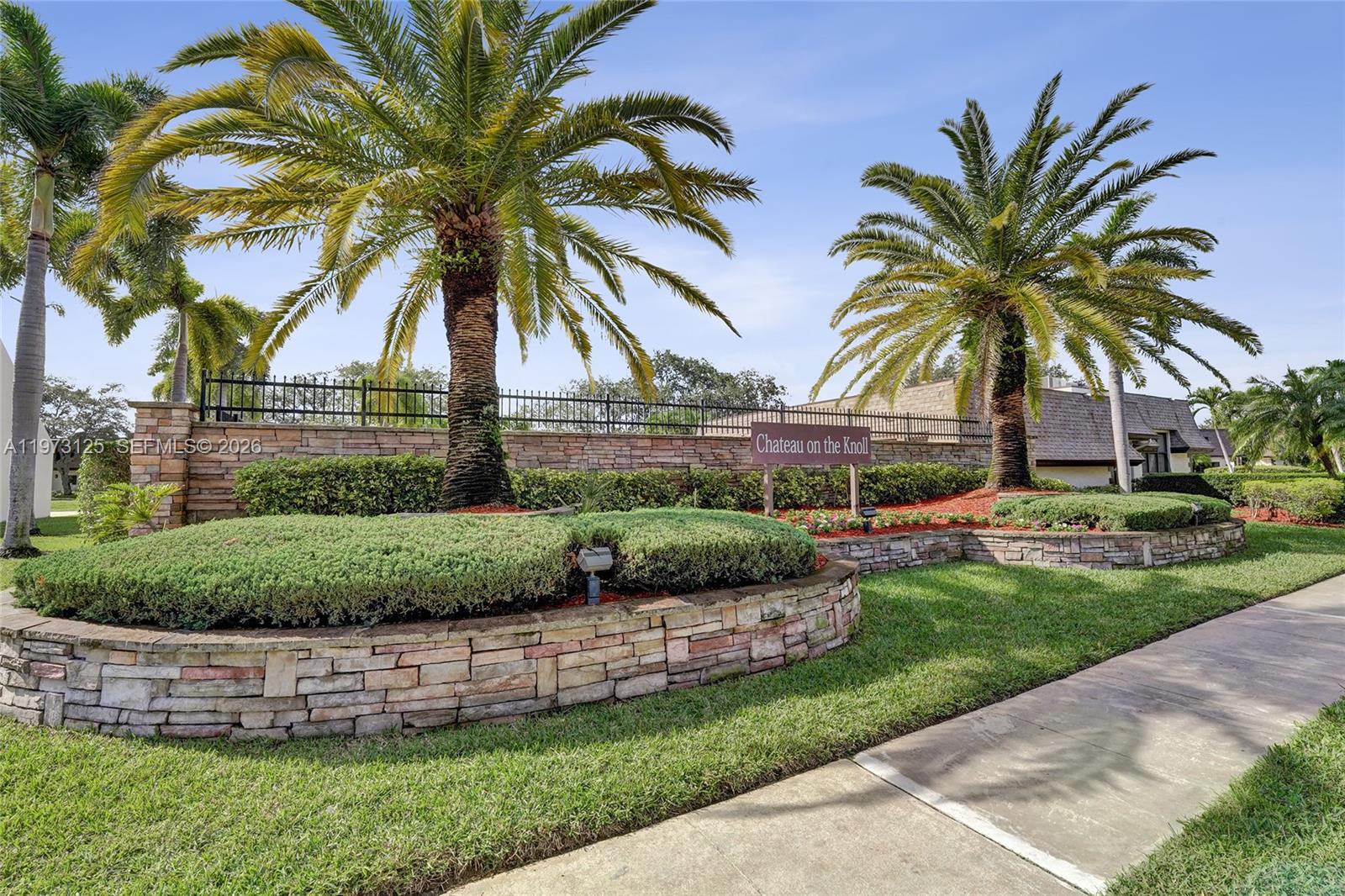 9340 Southwest 61st Way, Unit B Boca Raton, FL 33428 - Photo 24 of 25 a view of a backyard with a garden and plants