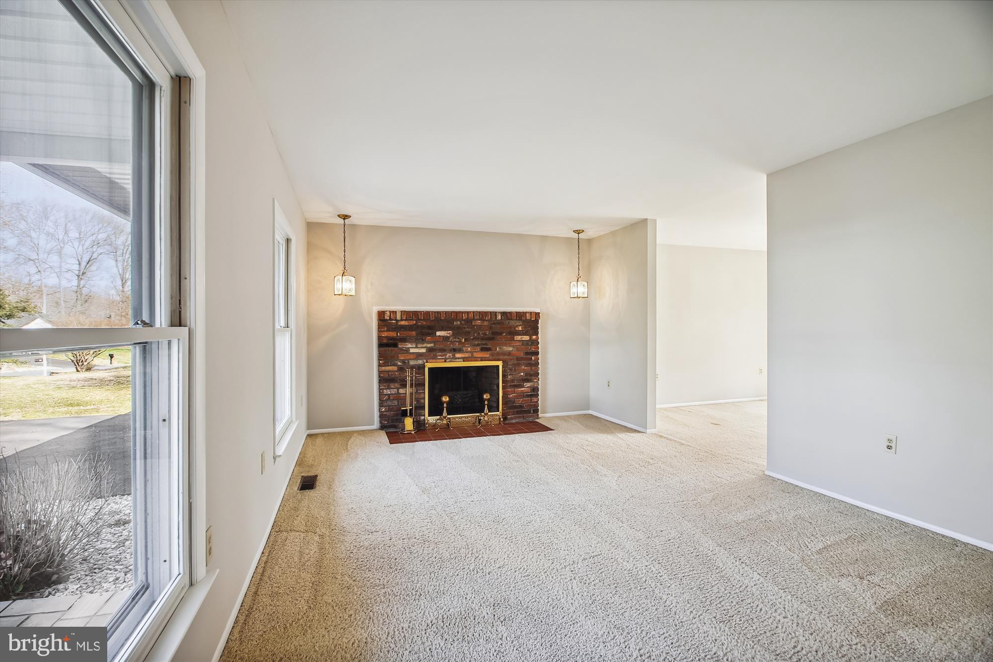 86 Milburn Circle Pasadena, MD 21122 - Photo 19 of 51 Living room with brick fireplace