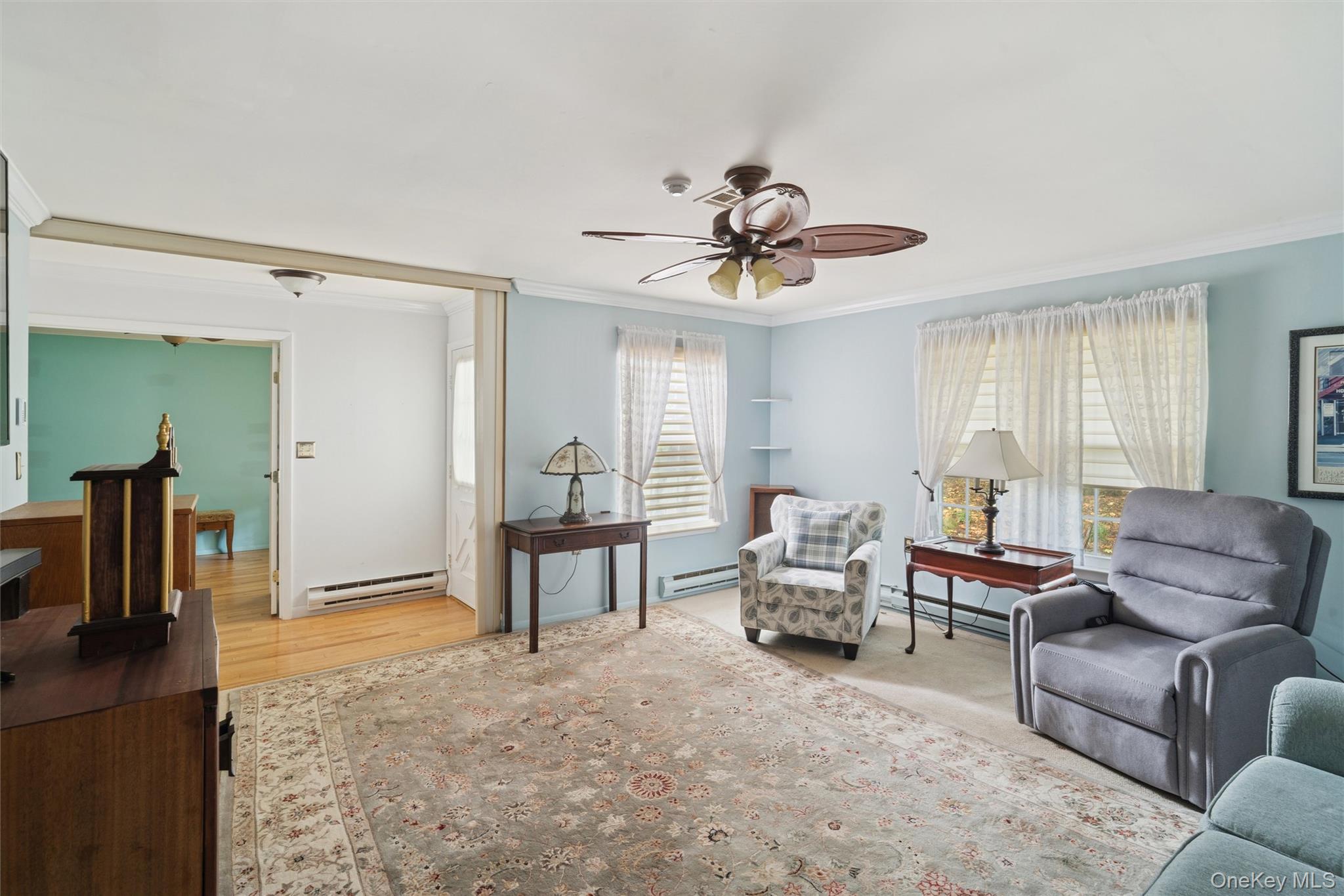 474 Darwen Drive, Unit B Ridge, NY 11961 - Photo 14 of 34 a living room with furniture and a flat screen tv
