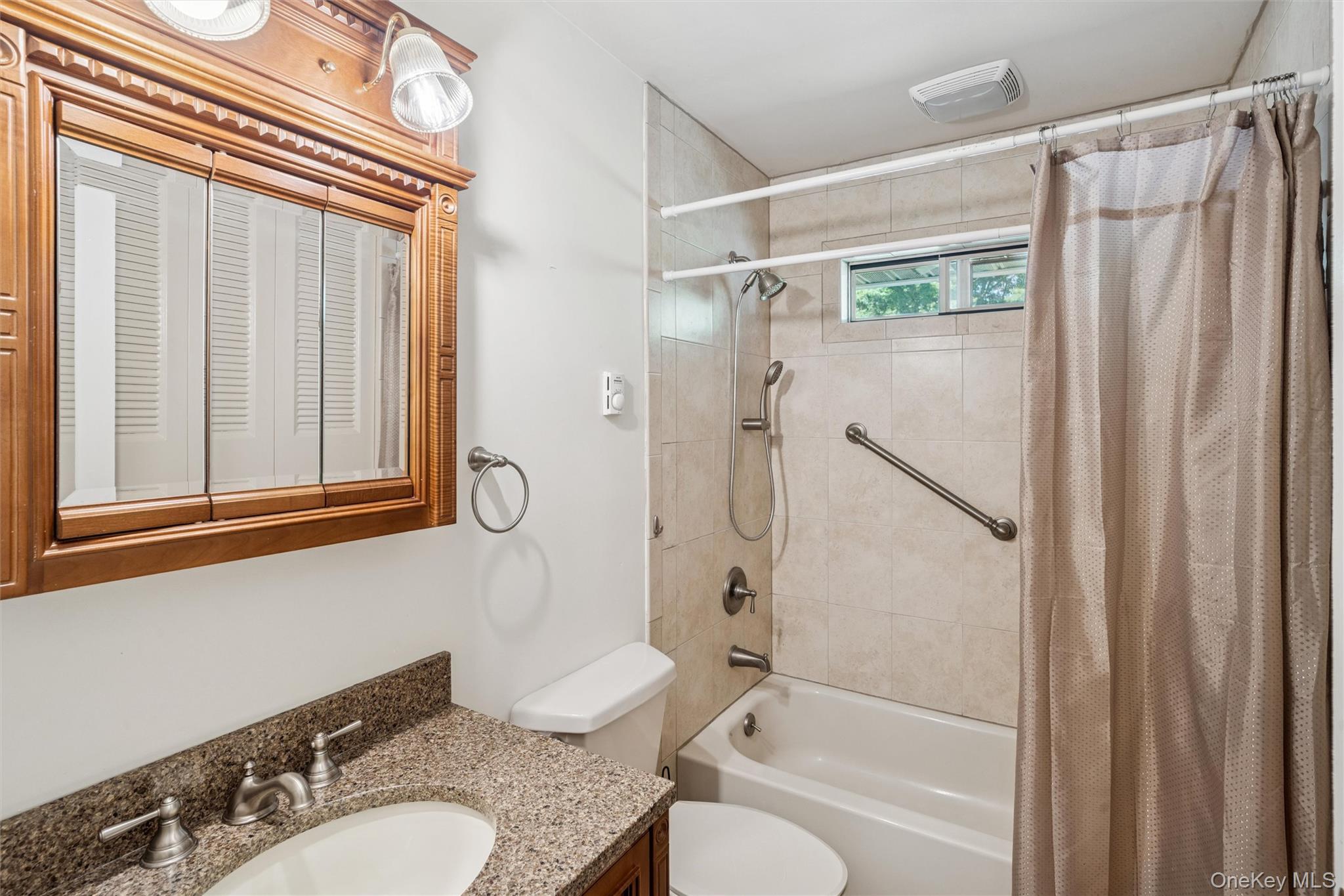 474 Darwen Drive, Unit B Ridge, NY 11961 - Photo 17 of 34 a bathroom with a granite countertop sink toilet and shower