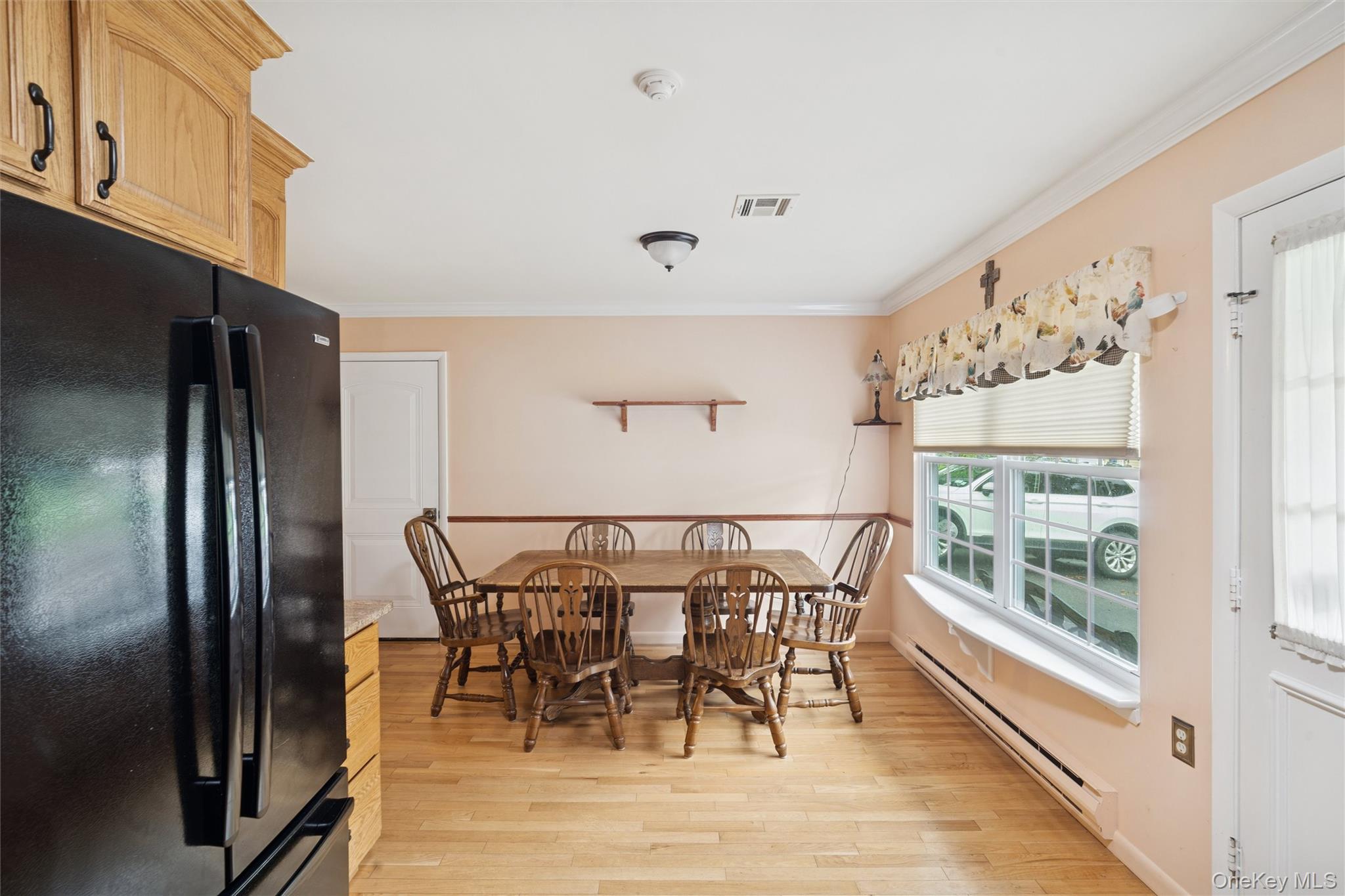 474 Darwen Drive, Unit B Ridge, NY 11961 - Photo 4 of 34 a view of a dining room with furniture window and outside view
