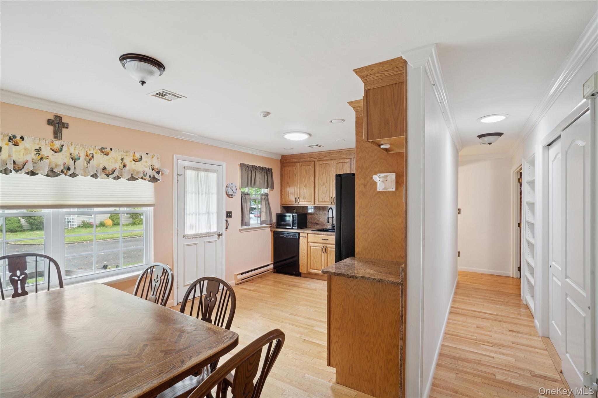 474 Darwen Drive, Unit B Ridge, NY 11961 - Photo 7 of 34 a dining room with furniture and window
