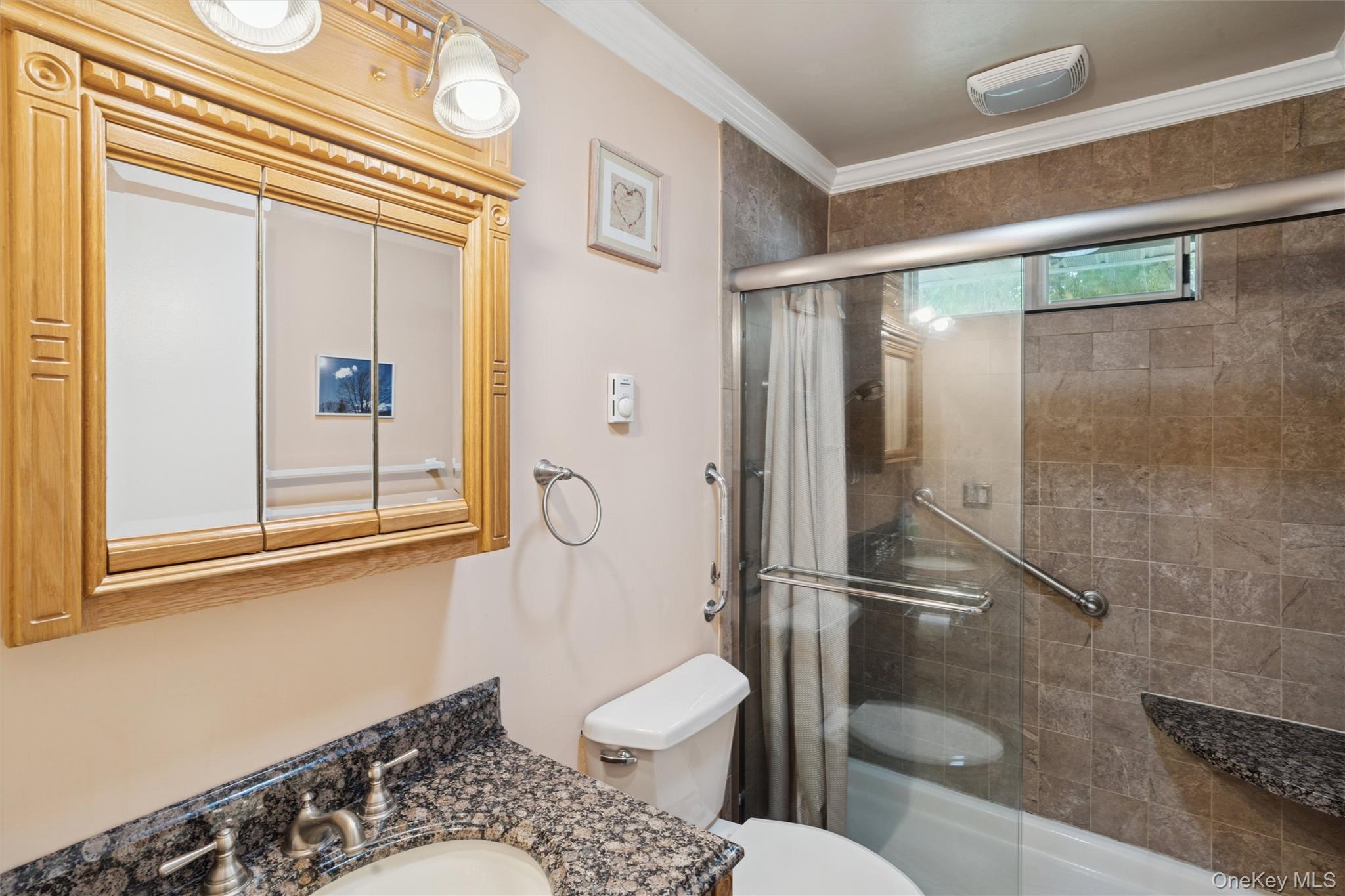 474 Darwen Drive, Unit B Ridge, NY 11961 - Photo 9 of 34 a bathroom with a toilet and a shower