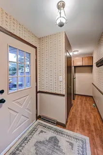 a bedroom with a bed and a large window