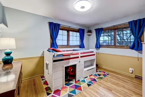 a bedroom with furniture and a window