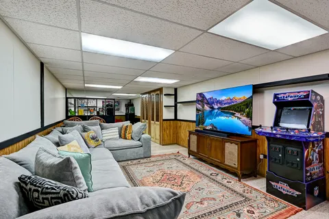 a living room with furniture and a flat screen tv