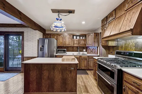 a kitchen with a stove and a refrigerator