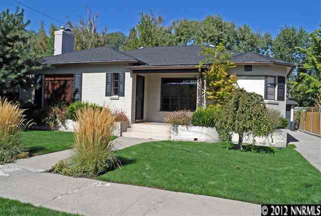 1025 Manor Drive Reno, NV 89509 - Photo 1 of 1 a front view of a house with a yard table and chairs