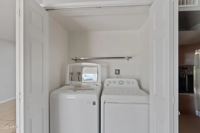 a utility room with dryer and washer