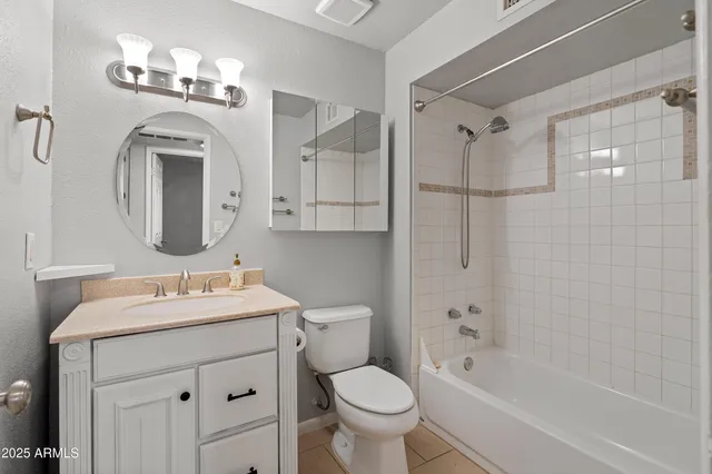 a bathroom with a sink toilet tub and shower