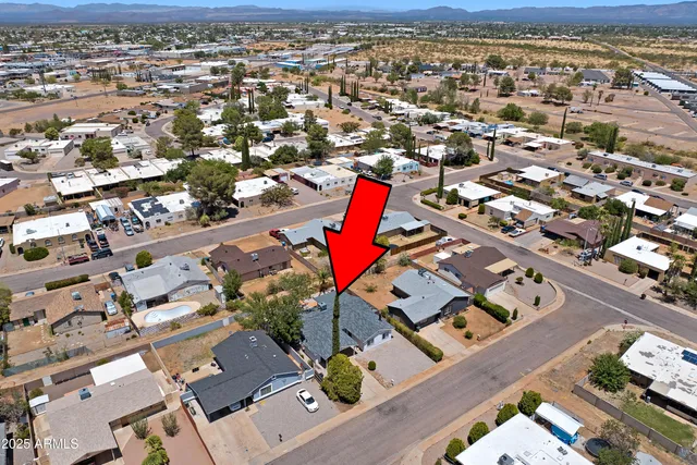 an aerial view of residential houses with outdoor space