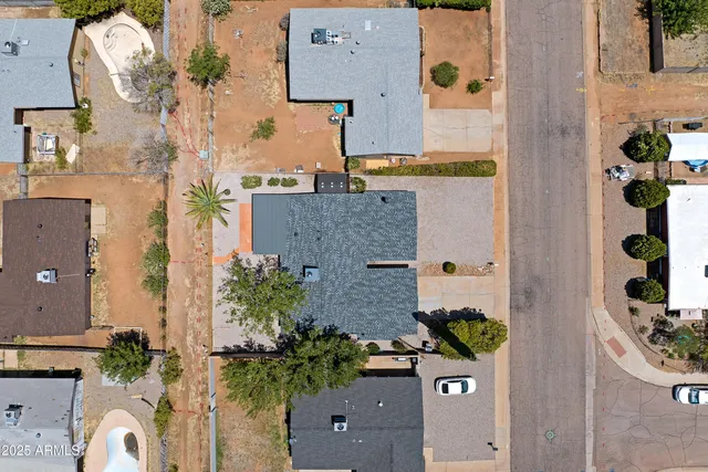 an aerial view of residential houses with outdoor space