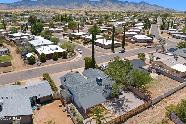 an aerial view of residential houses with outdoor space
