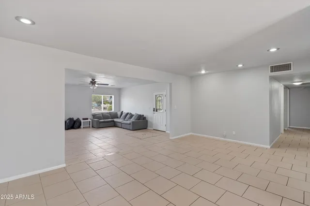 a view of a livingroom with a couch and chandelier