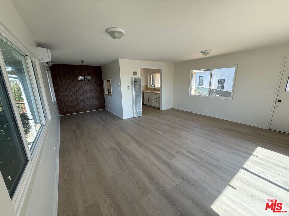 3237 Midvale Avenue Los Angeles, CA 90034 - Photo 11 of 24 wooden floor in an empty room with a window